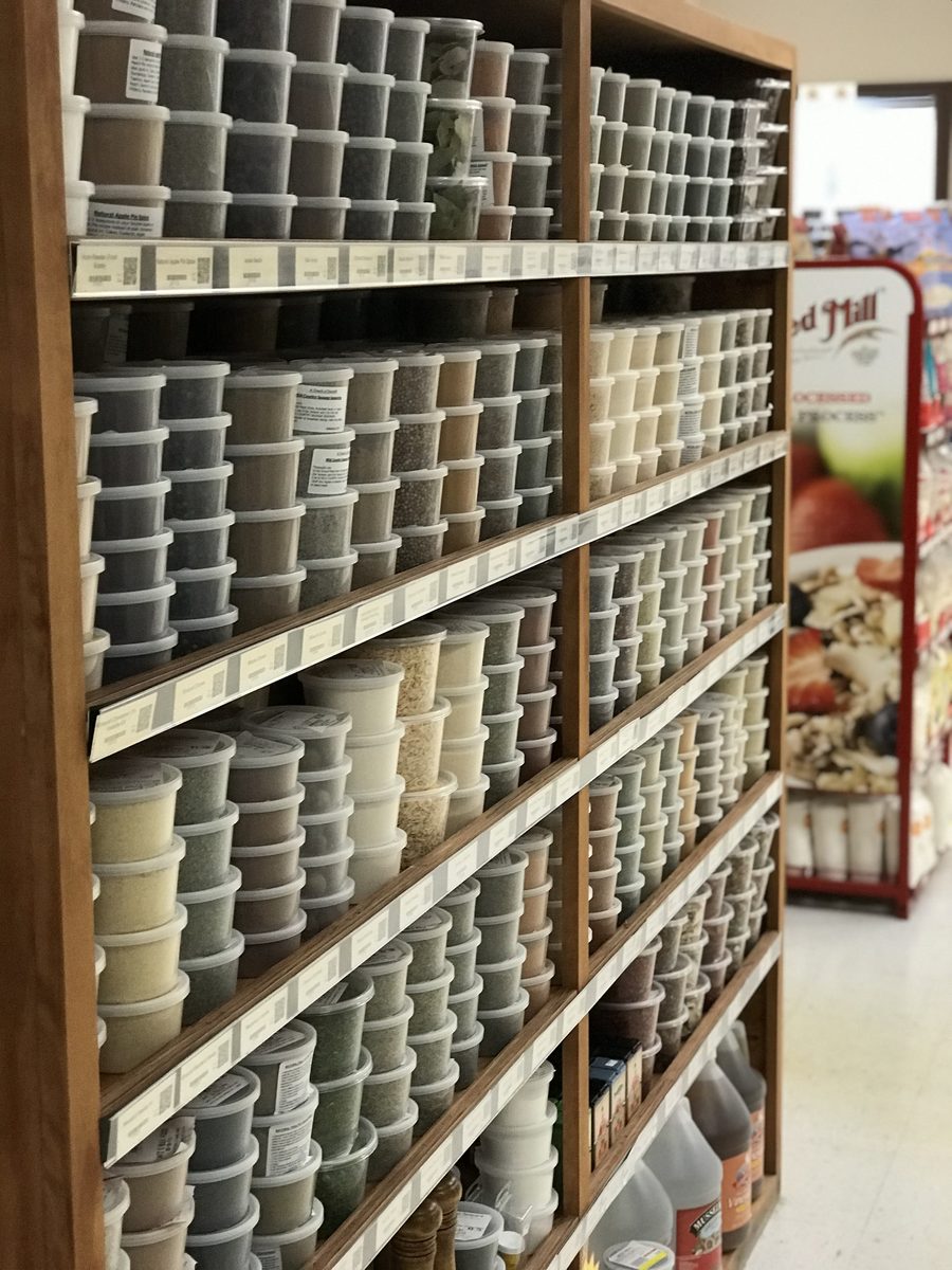 A floor-to-ceiling wall of house-packed spice tubs at Lantz's Bulk Foods
