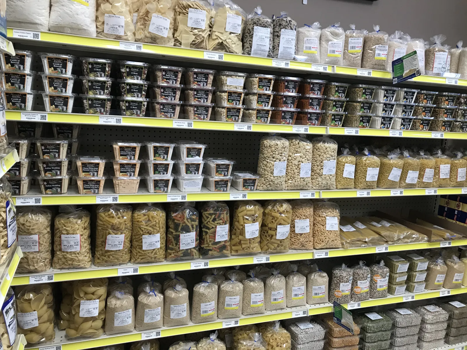 Bulk food aisles at Lantz's Bulk Foods, bags of pasta, grains and snacks on the shelves